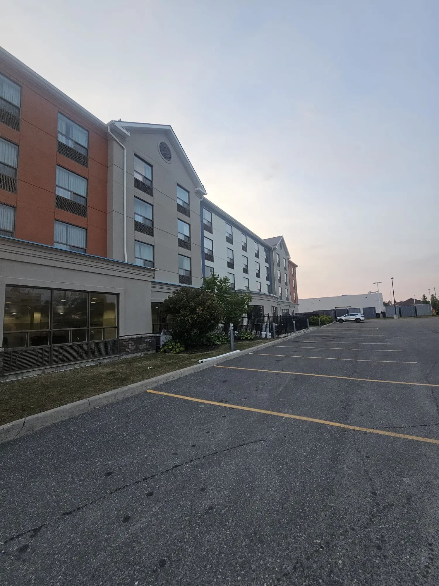 Holiday Inn Express, New Liskeard — Gable bay, banded cornice and stone base at the ground floor