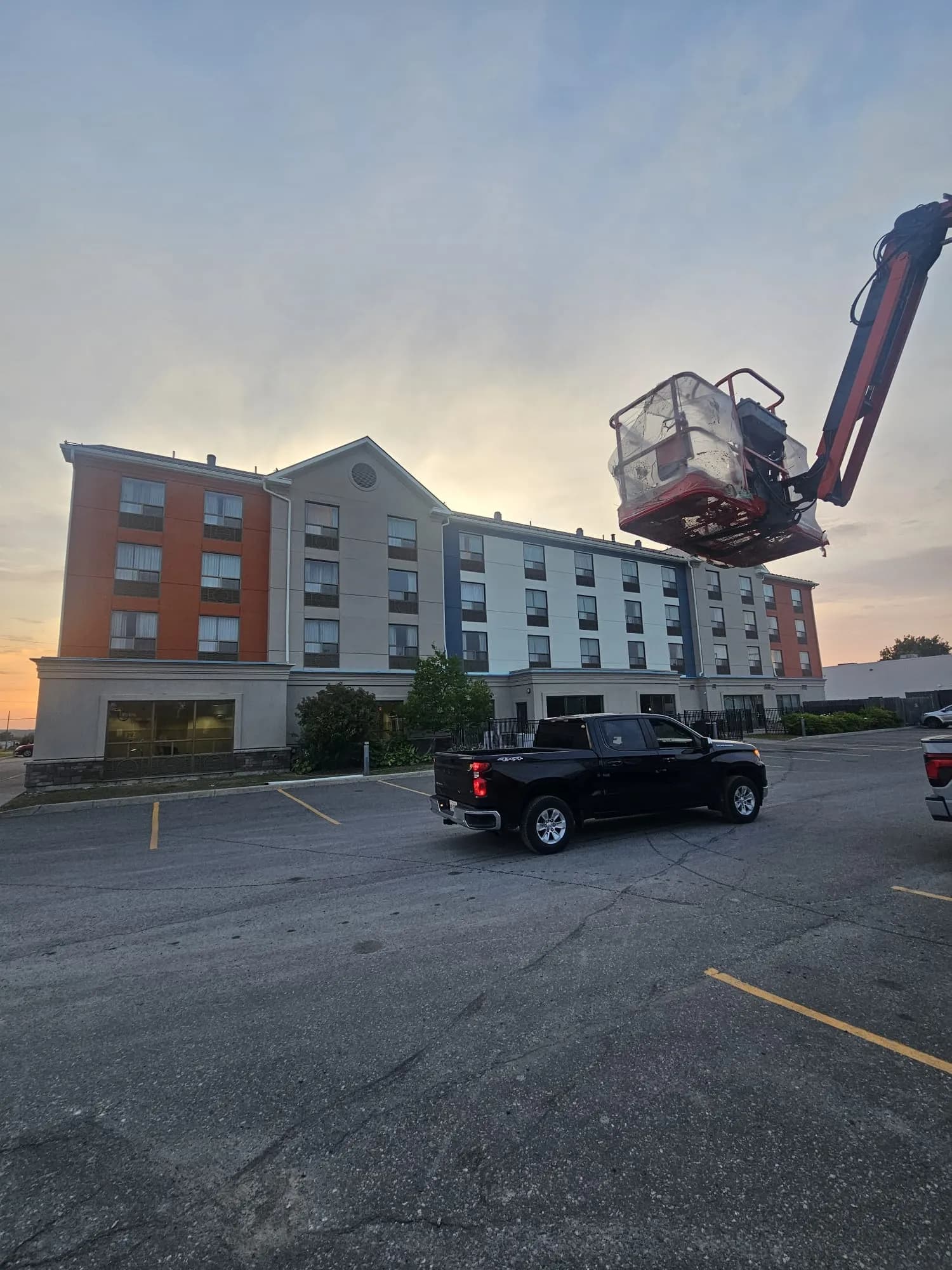 Holiday Inn Express, New Liskeard — Basket lowered at the end of a shift, full front elevation behind