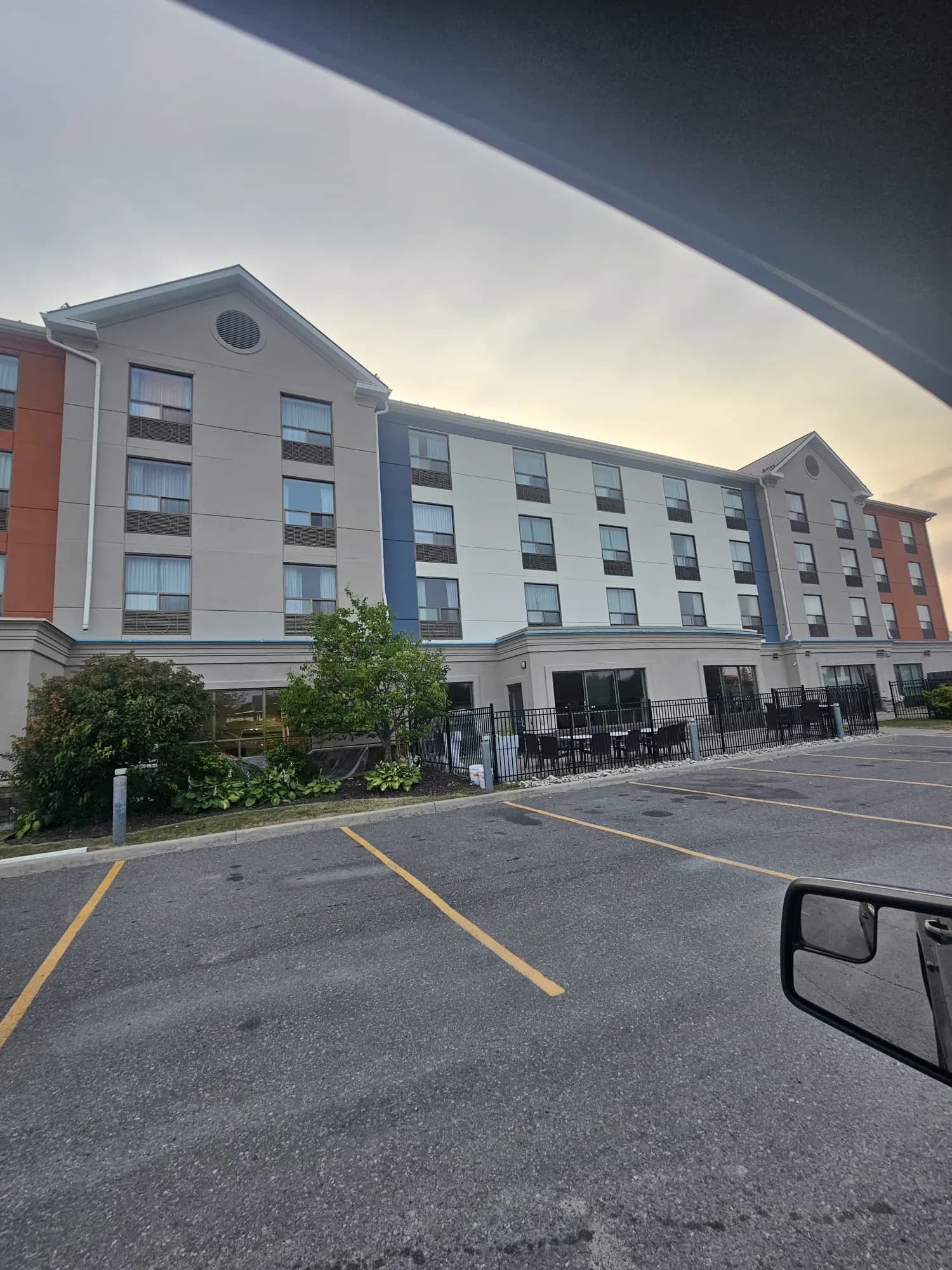 Holiday Inn Express, New Liskeard — Patio elevation finished, banding carried around the curve