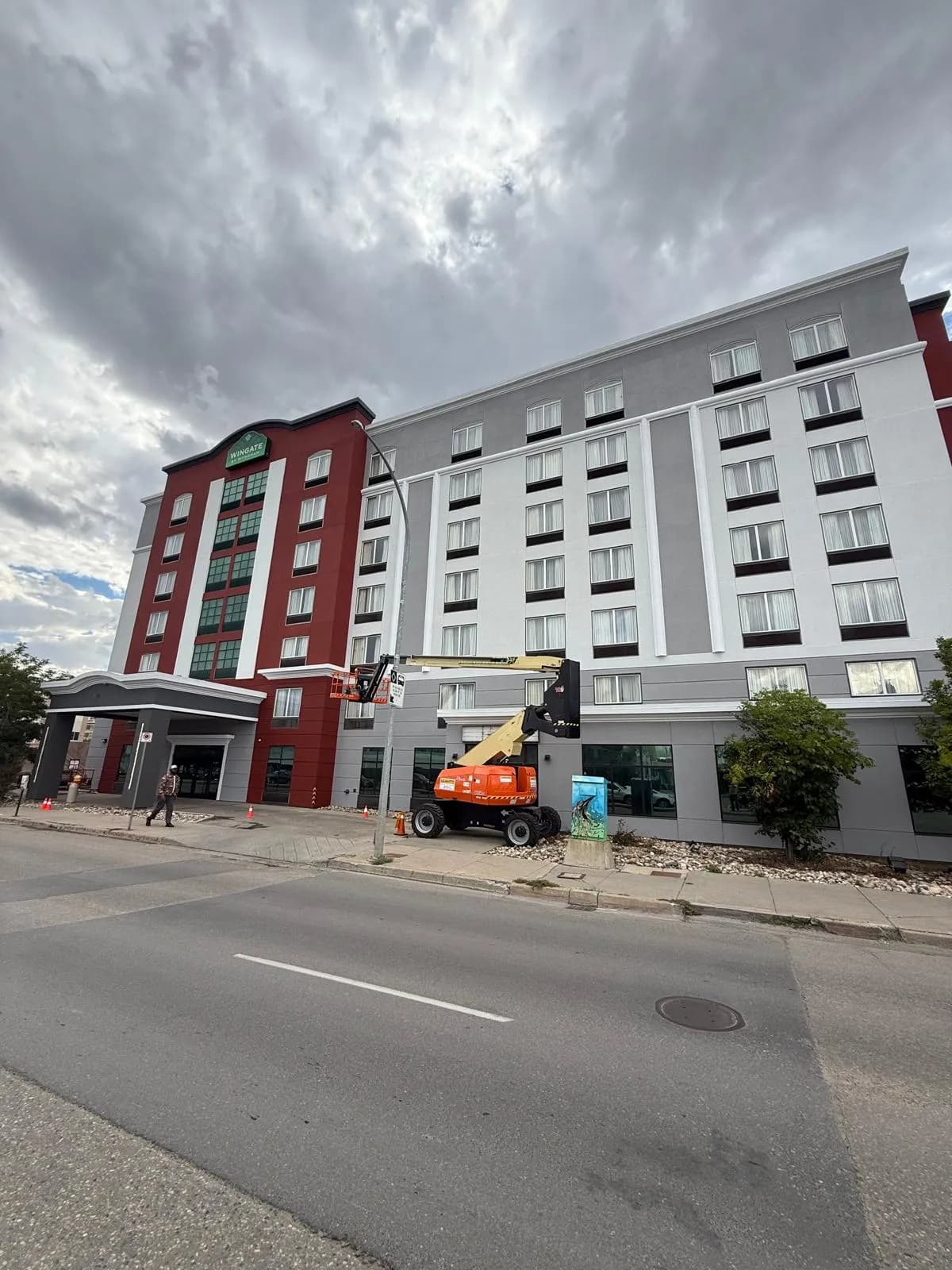 Wingate by Wyndham, Regina — Working the long wing from the street, lane coned off