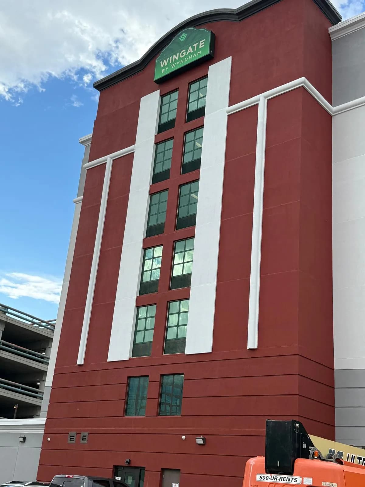 Wingate by Wyndham, Regina — Signage tower with the fins cut in either side of the glazing