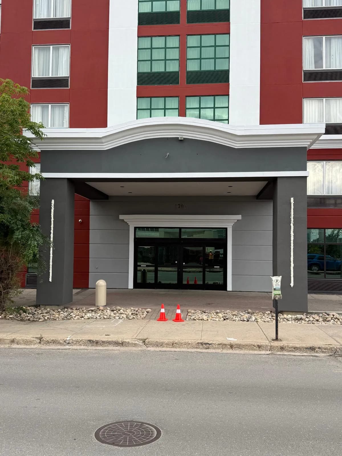 Wingate by Wyndham, Regina — Canopy soffit and doors, grey against the red field